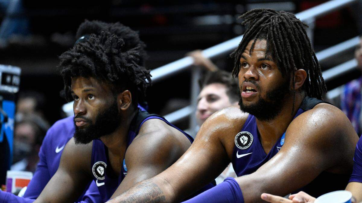 TCU’s Mike Miles, left, and Eddie Lampkin, right, sit on the bench during the second half of a second-round NCAA college basketball tournament game against Arizona, Sunday, March 20, 2022, in San Diego. Arizona won 85-80 in overtime. (AP Photo/Denis Poroy)