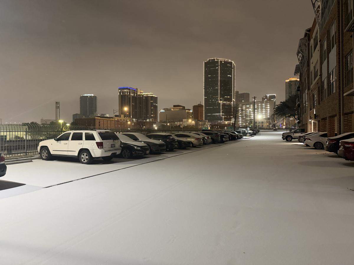 About an inch of sleet and snow has fallen in downtown Fort Worth, and more could be on the way midday Sunday.