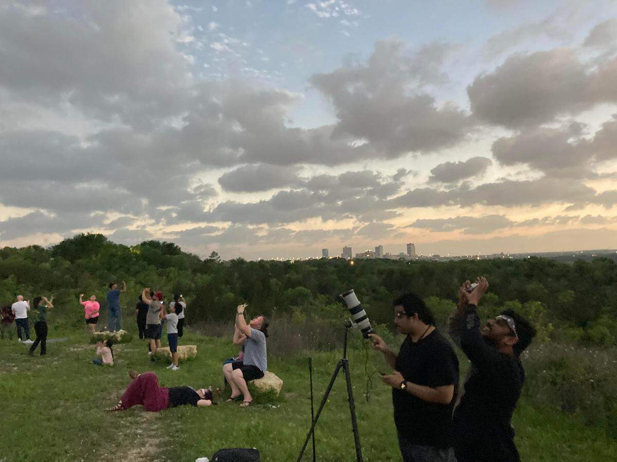 On Tandy Hill Natural Area in East Fort Worth, hundreds of people gathered to see the total solar eclipse on Monday. At 1:41 p.m., people enjoyed mother nature’s show, cool temperatures, and the lights all over downtown Fort Worth were aglow.