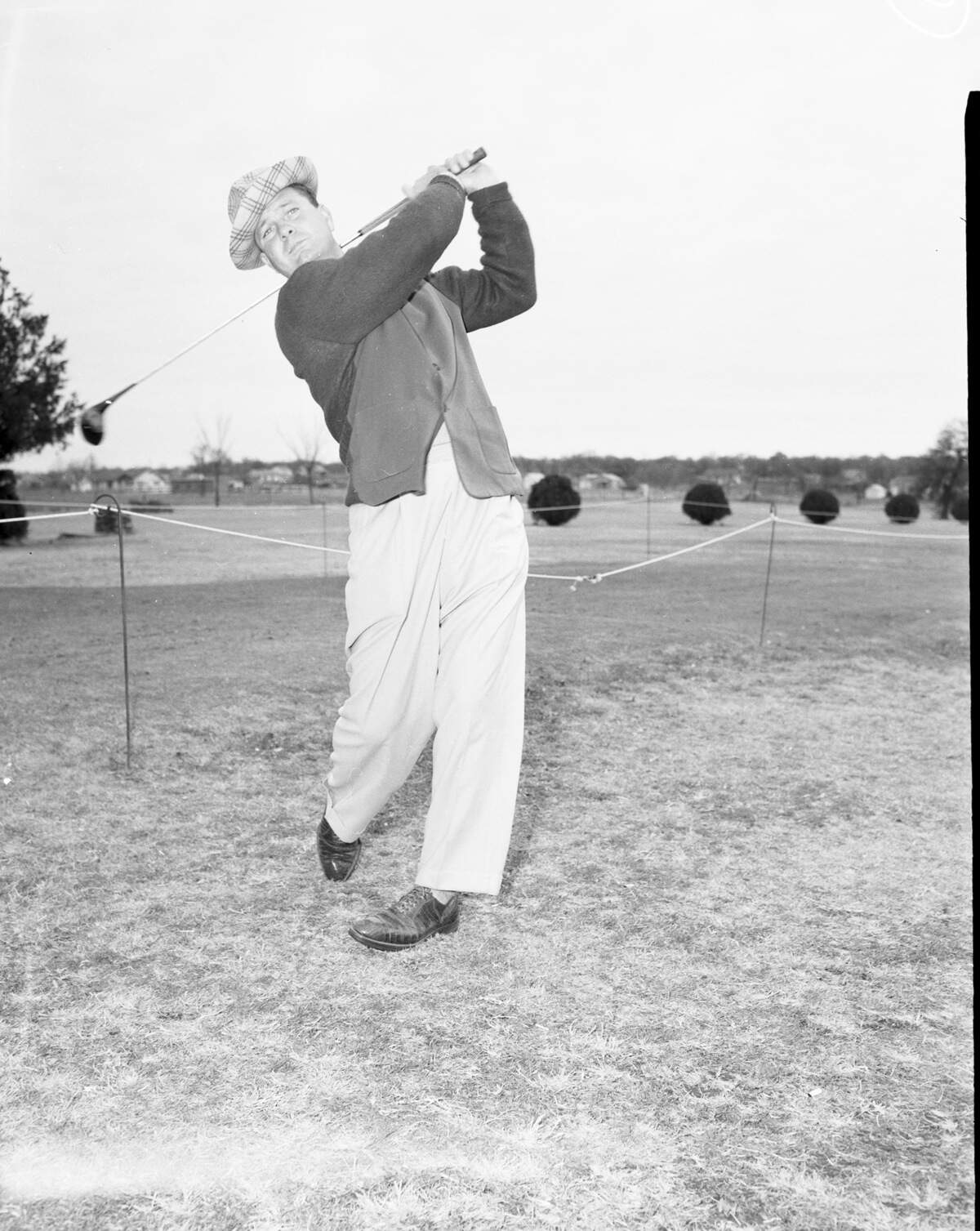 Golfer Jimmy Demaret dressed for cold weather in the 1945 pro golf tournament at Glen Garden.
