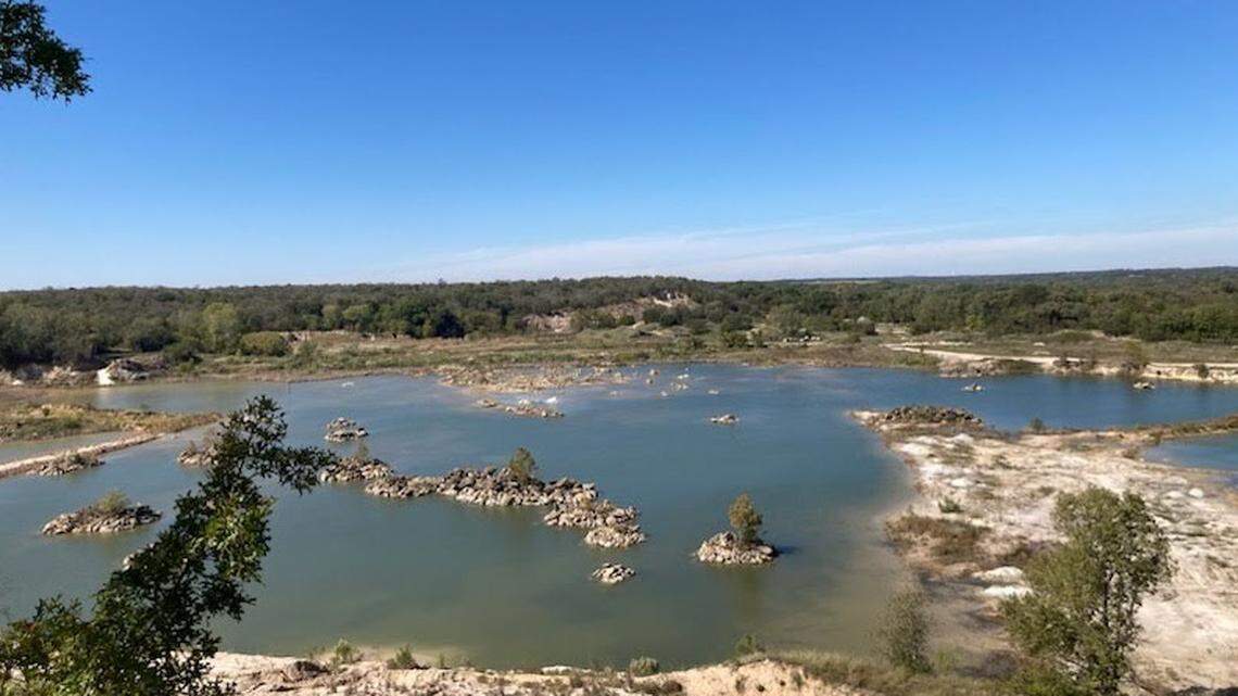 An aquifer surrounded by rocks and trees