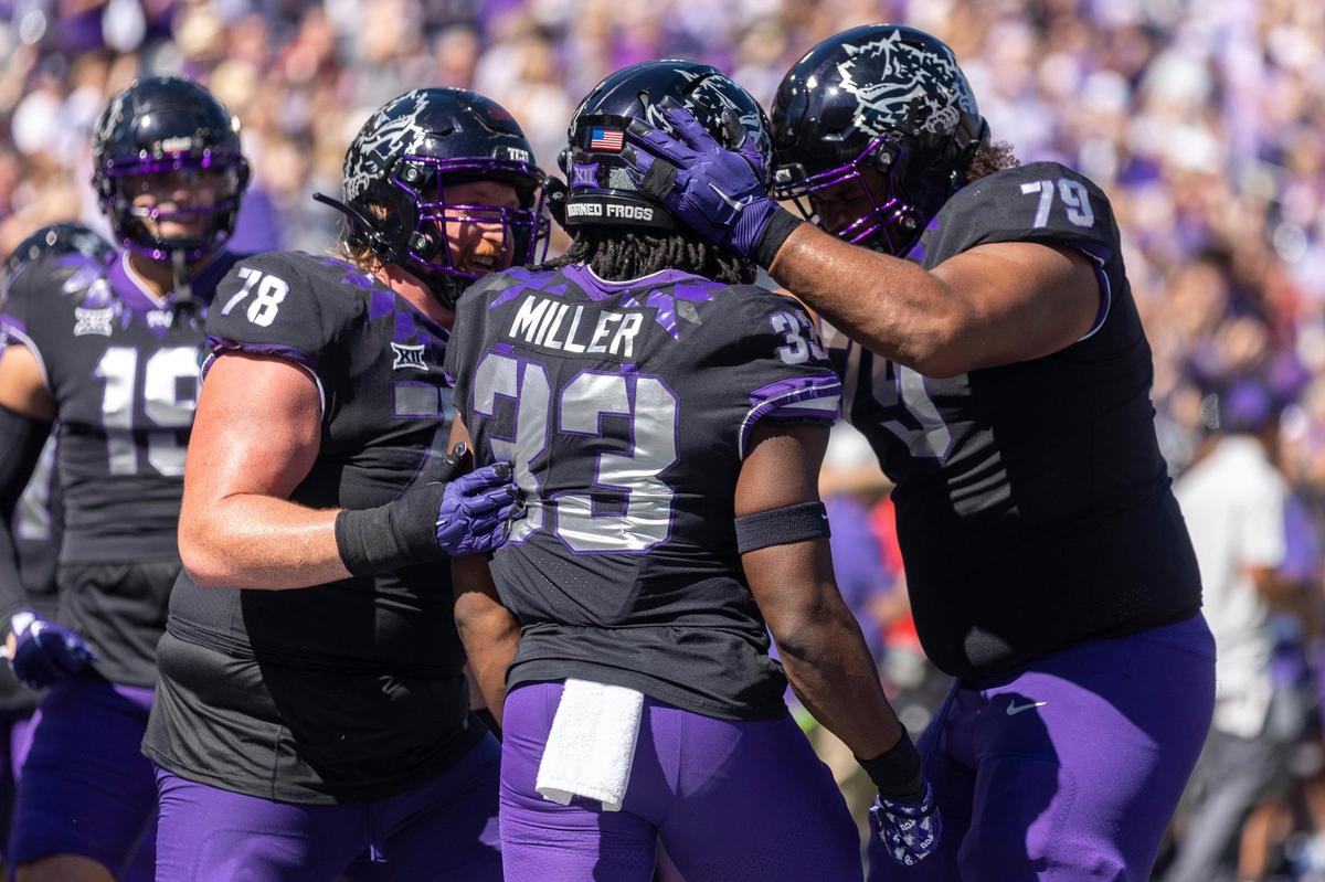 TCU guard Wes Harris, TCU running back Kendre Miller and TCU center Steve Avila celebrate after Miller scores a touchdown during their game against OU at the Amon G. Carter Stadium in Fort Worth, Texas, on Saturday, Oct. 1, 2022.