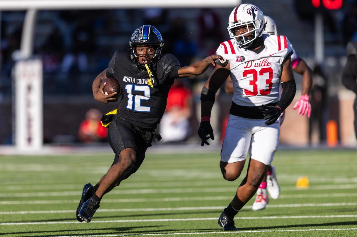 North Crowley quarterback Chris Jimerson Jr. (12) runs up field on a quarterback keep play in the first half of the Class 6A Division I state semifinal game at Eagle Stadium in Allen on Saturday, Dec. 14, 2024.