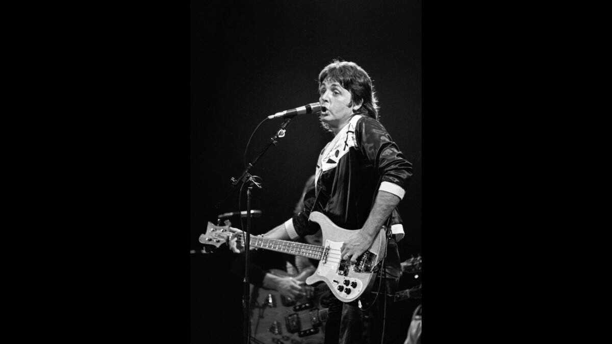 Paul McCartney and Wings opened their first United States tour, “Wings Over America,” at the Tarrant County Convention Center, attracting a packed house which was sold out two months before the show. The ex-Beatle, Paul McCartney, is seen here performing on stage during the concert; 05/03/1976.