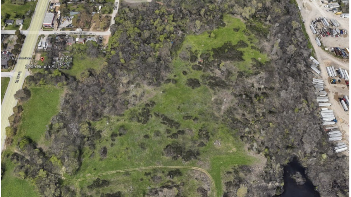 An aerial snapshot of 31.33 acres of vacant land off Beach Street, where developers hope to construct a roughly 308-unit “cottage style” rental community. City council supported the proposal April 8.
