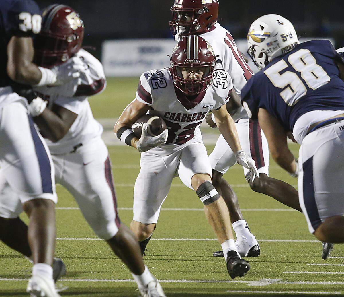Keller Central’s Spencer Martin (32) looks for a hole against Keller during their game at Keller ISD Athletic Complex on Friday, Sep. 26, 2025.