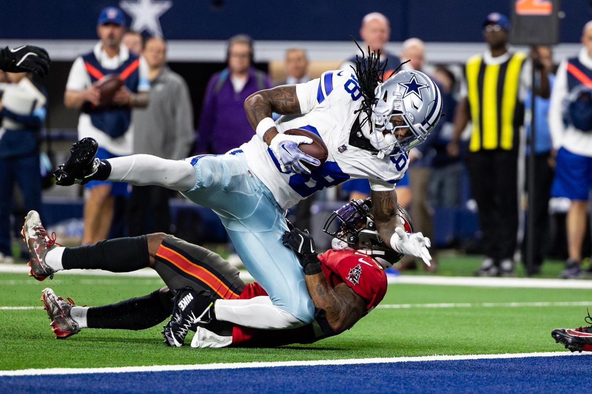 Cowboys wide receiver CeeDee Lamb (88) dives for an attempt at a touchdown in the first half of an NFL game between the Dallas Cowboys and the Tampa Bay Buccaneers at AT&T Stadium in Arlington on Sunday, Dec. 22, 2024.