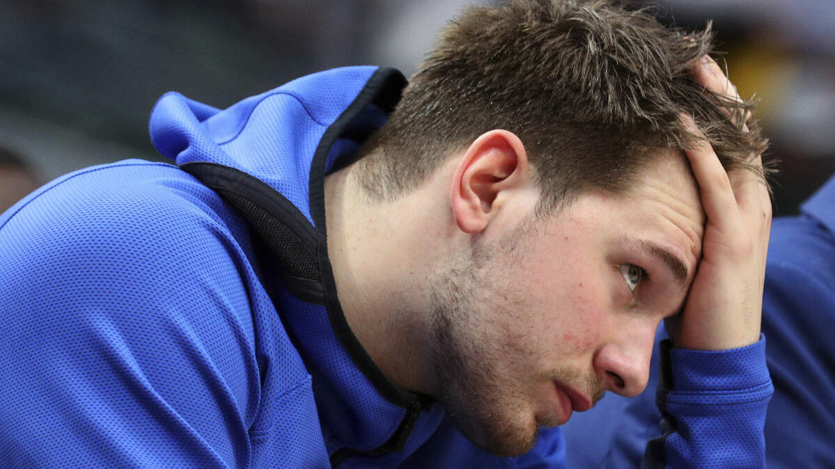 Dallas Mavericks forward Luka Doncic sits on the bench in the fourth quarter of the team’s NBA basketball game against the Los Angeles Lakers on Friday, Jan. 10, 2020, in Dallas. (AP Photo/Richard W. Rodriguez)