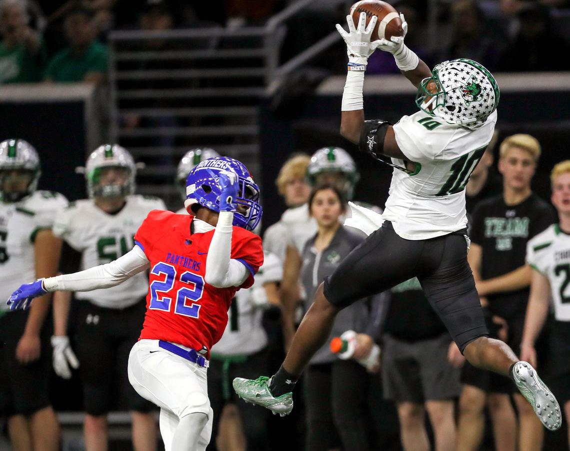 Southllake Carroll wide receiver R.J.Mickens (10) comes up with a reception against Duncanville defensive back Ennis Rakestraw (22) during the first half, Saturday afternoon, December 8, 2018 in the 6A Division I quarterfinal playoff game played at the Ford Center in Frisco, TX.