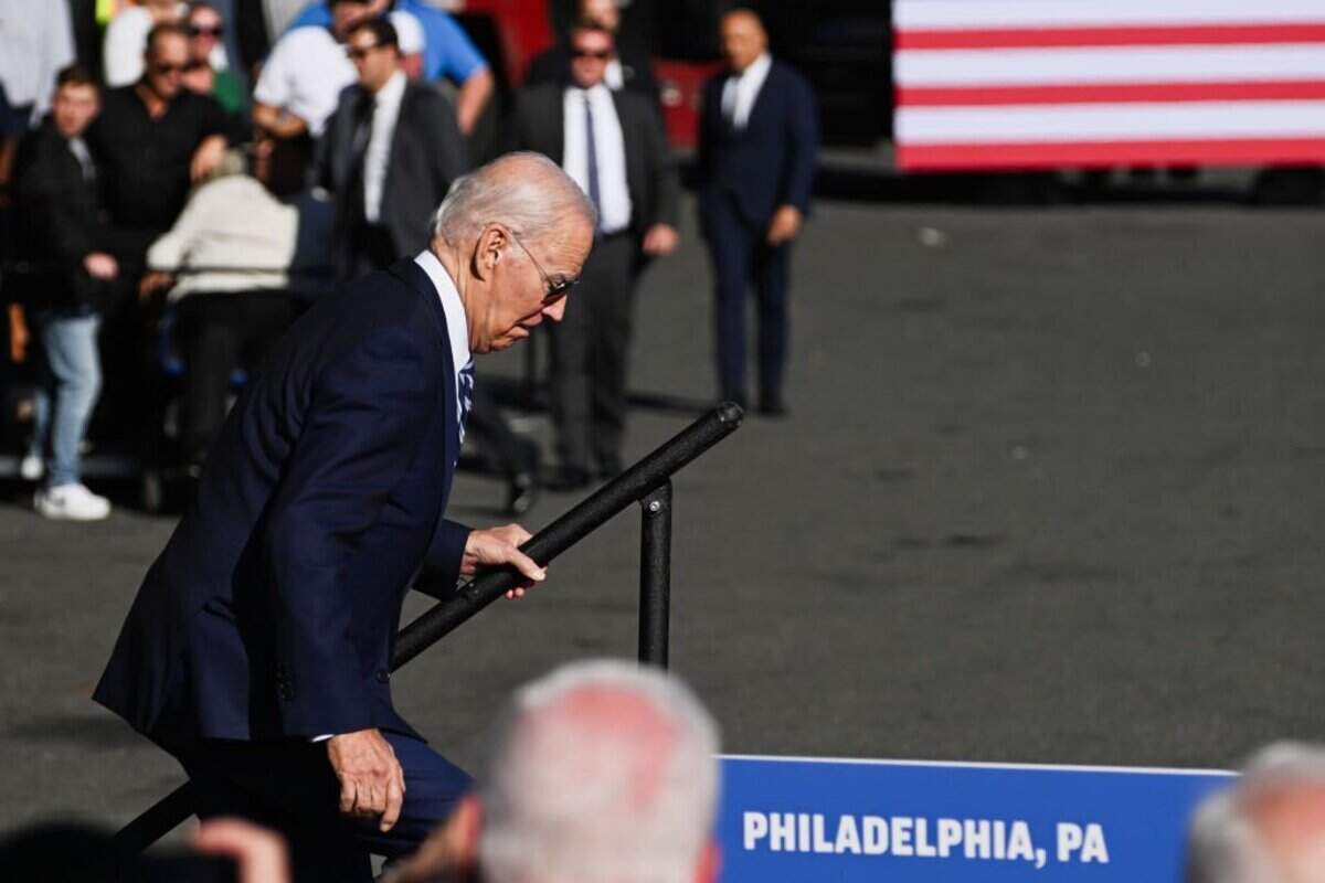 PHILADELPHIA, PENNSYLVANIA - OCTOBER 13: U.S. President Joe Biden reacts as he stumbles while taking the stage to speak at Tioga Marine Terminal on October 13, 2023 in Philadelphia, Pennsylvania. Biden discussed how his Bidenomics agenda is creating good-paying union jobs, investing in infrastructure, accelerating the transition to a clean energy future, and combatting the climate crisis. (Photo by Mark Makela/Getty Images)