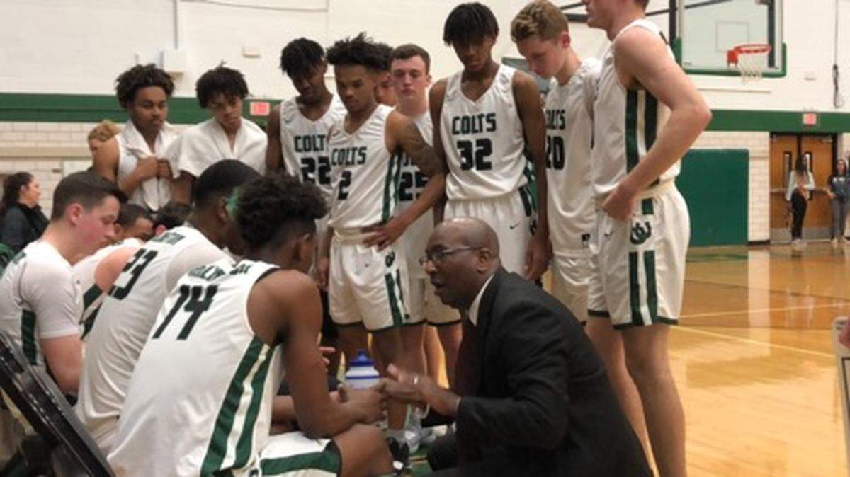 Arlington head coach Paul Williams talks to his team during a timeout on Tuesday, Feb. 12, 2019. The Colts defeated Fort Worth YMLA 40-30.