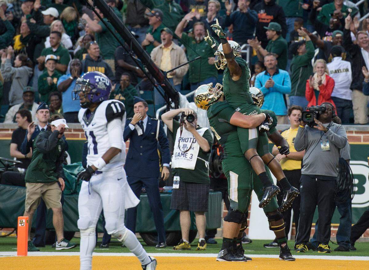 Oct 11, 2014; Waco, TX, USA; Baylor Bears running back Corey Coleman (1) and his teammates celebrate his game tying touchdown against the TCU Horned Frogs during the fourth quarter at McLane Stadium. The Bears defeat Horned Frogs 61-58. Mandatory Credit: Jerome Miron-USA TODAY Sports