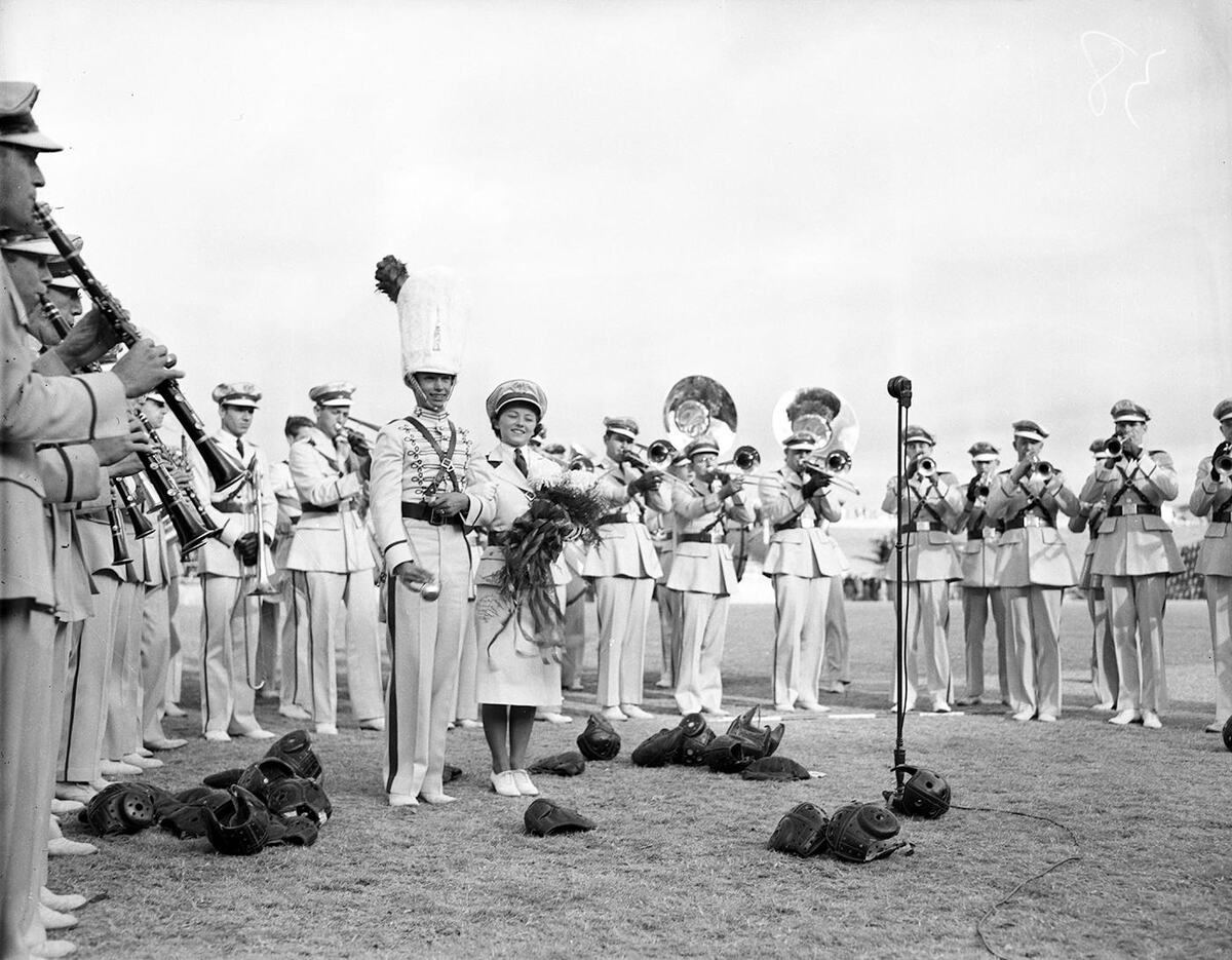 Members of the Texas Christian University band performing during the TCU-SMU football game in 1937 During the game, Amon G. Carter was presented with a scroll naming him “honorary band leader for life” by TCU band leader Don Gillis.