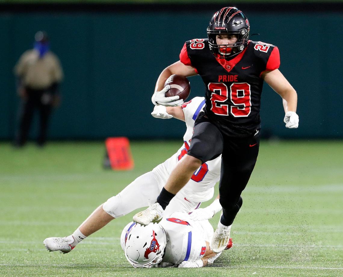 Colleyville Heritage running back Braxton Ash (29) gains yardage during a high school football game at Globe Life Park in Arlington, Texas, Saturday, Sept. 26, 2020. Colleyville led 28-24 at the half. (Special to the Star-Telegram Bob Booth)