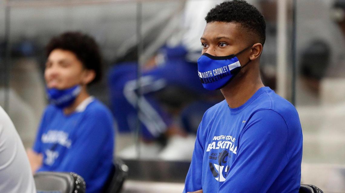 North Crowley senior forward Mike Hall, right, was severely injured in a car accident in May, but after months of intense therapy he was able to rejoin his team. (Special to the Star-Telegram Bob Booth)