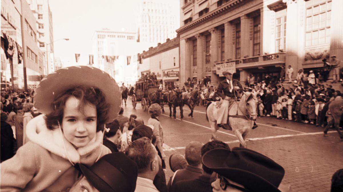 Jan. 29, 1965: Stock Show parade in downtown Fort Worth; 4-year-old Ellen Egloff rides on dad Jack D. Egloff’s shoulders. 
