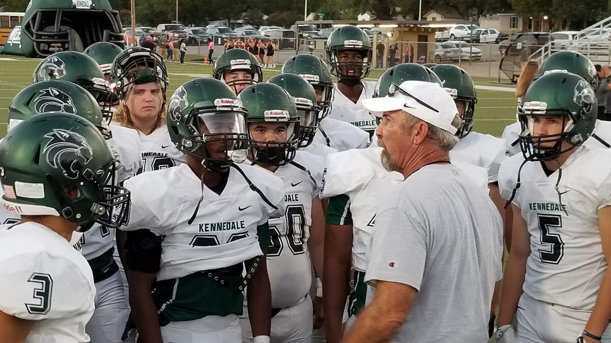 Kennedale coach Richard Barrett instructs his Wildcats before their game against Fort Worth Western Hills at Scarborough-Handley Field on Friday, Oct. 5, 2018.