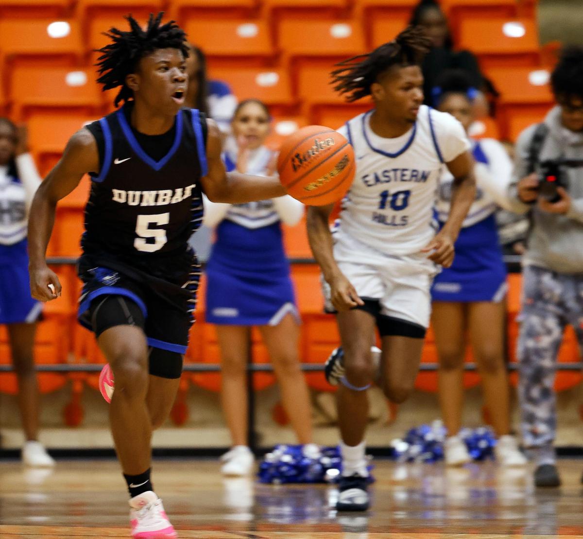 Dunbar’s Johnathan Williams (5) drives the ball down court in front of Eastern Hills guard Siyan Briggs (10) in the first quarter of a high school basketball game at Wilkerson Greines Activity Center in Fort Worth, Texas, Saturday, Jan, 27, 2024.
