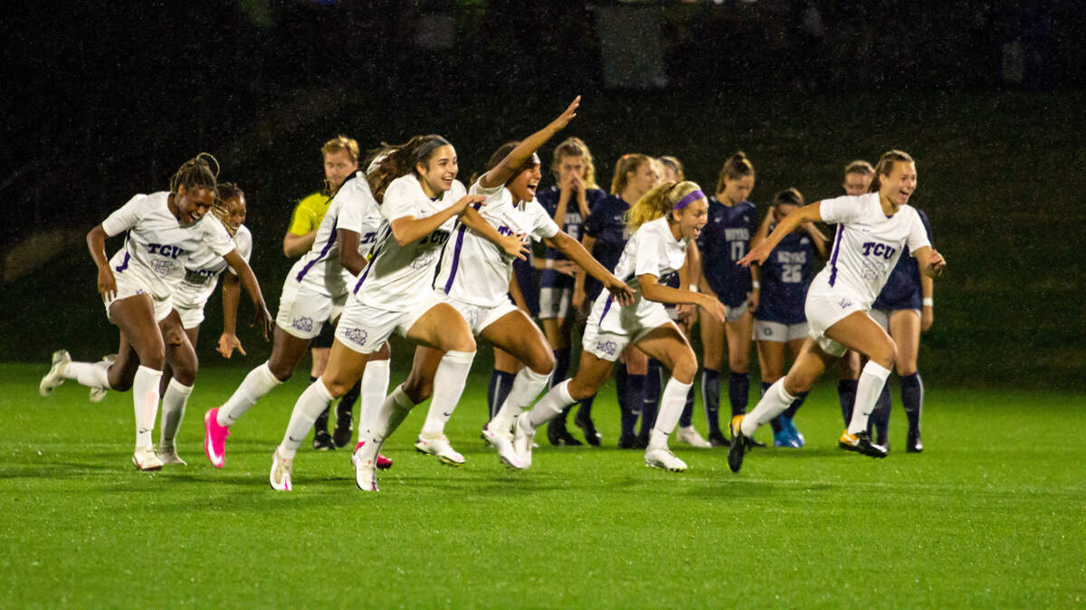 Members of the TCU women’s soccer team celebrate their win over Georgetown in the NCAA Tournament. TCU will play Virginia on Sunday in the Elite Eight in North Carolina.