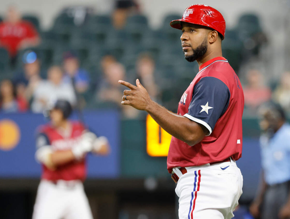 Former Texas Ranger Adrian Beltre signals a player on second during the minor league all-stars Futures Game at Globe Life Field in Arlington, Texas, Saturday July 13, 2024. (Special to the Star-Telegram/Bob Booth)