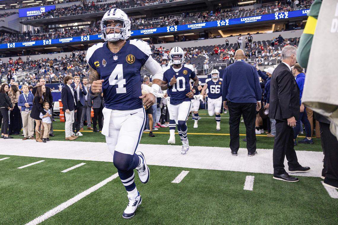 Cowboys quarterback Dak Prescott (4) runs out of the tunnel prior to the first half of an NFL game between the Dallas Cowboys and the Kansas City Chiefs at AT&T Stadium in Arlington on Thursday, Nov. 27, 2025.