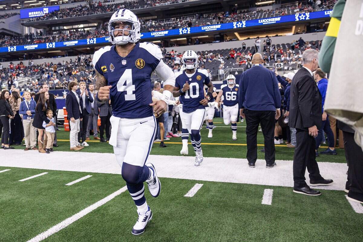 Cowboys quarterback Dak Prescott (4) runs out of the tunnel prior to the first half of an NFL game between the Dallas Cowboys and the Kansas City Chiefs at AT&T Stadium in Arlington on Thursday, Nov. 27, 2025.