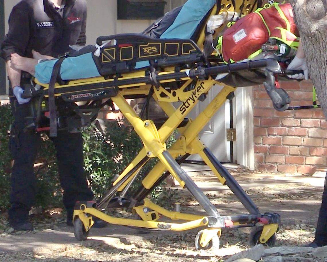 Medstar EMT's transport a woman to JPS Hospital on Jan. 23 after Fort Worth CIT officers found that she had taken a mixture of prescription and over the counter medications.