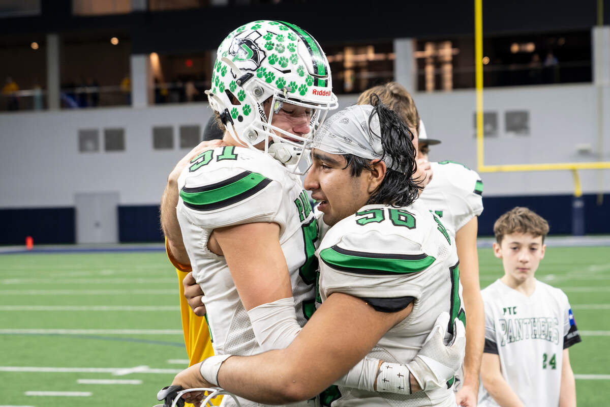 Paradise linebacker Blake Read (51), left, and lineman Pablo Carrillo (56) console one another after falling to Malakoff in a Class 3A Division 1 state quarterfinal on Thursday, Dec. 12, 2024 at the Ford Center in Frisco, Texas.