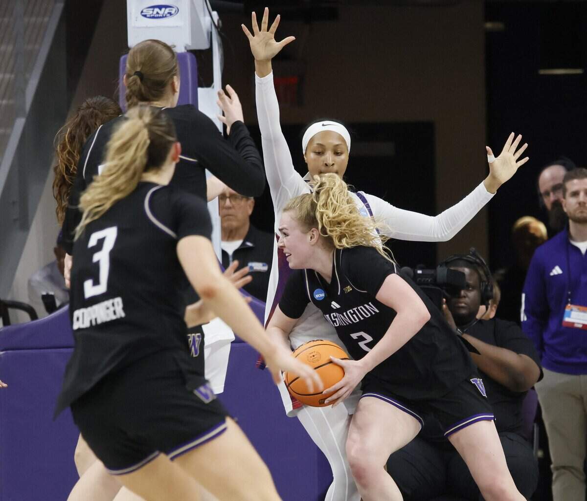 TCU guard Taylor Bigby (1) gets in the scrum guarding Washington guard Avery Howell (2) during the first half of a second round NCAA Division I Women's Basketball Championship game at Schollmeier Arena in Fort Worth, Texas, Sunday, March, 22, 2026.