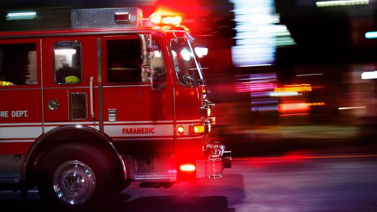 A fire engine races to the scene of an emergency.