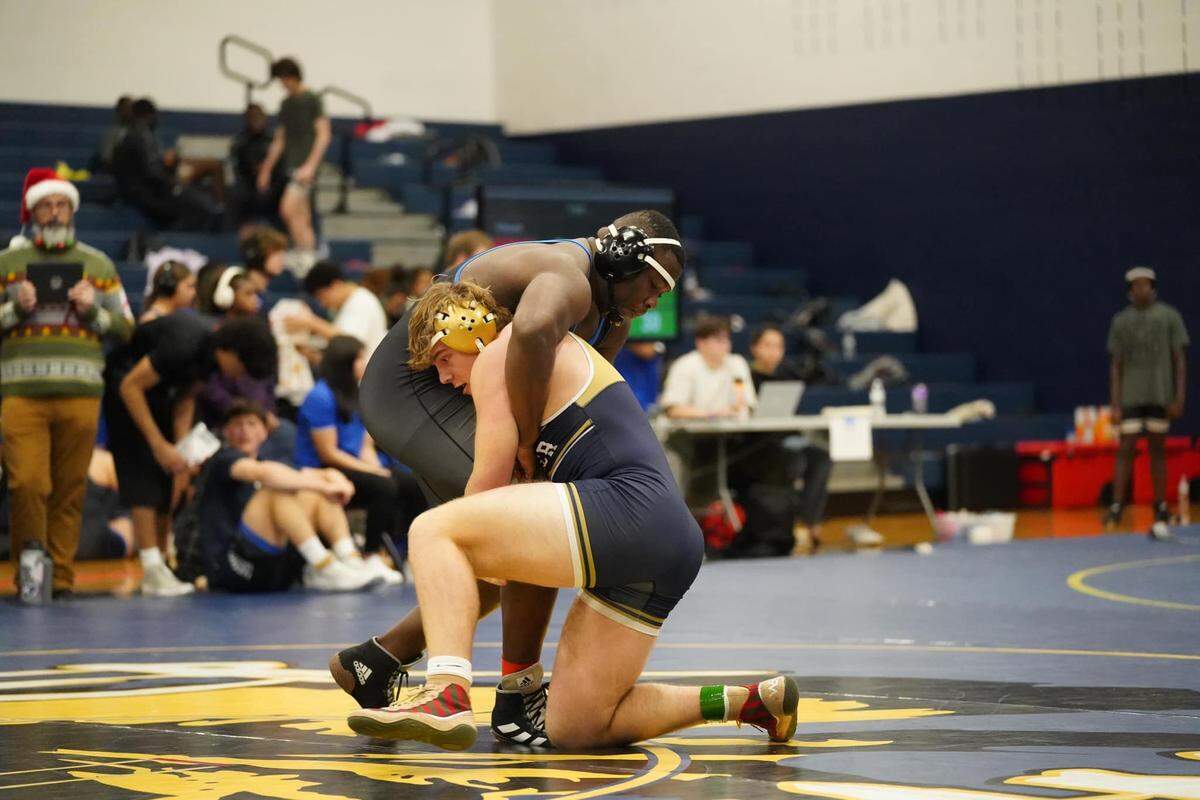 Keller senior Andrew Jurasek (right) is the 2025 heavyweight wrestling champion of Texas.