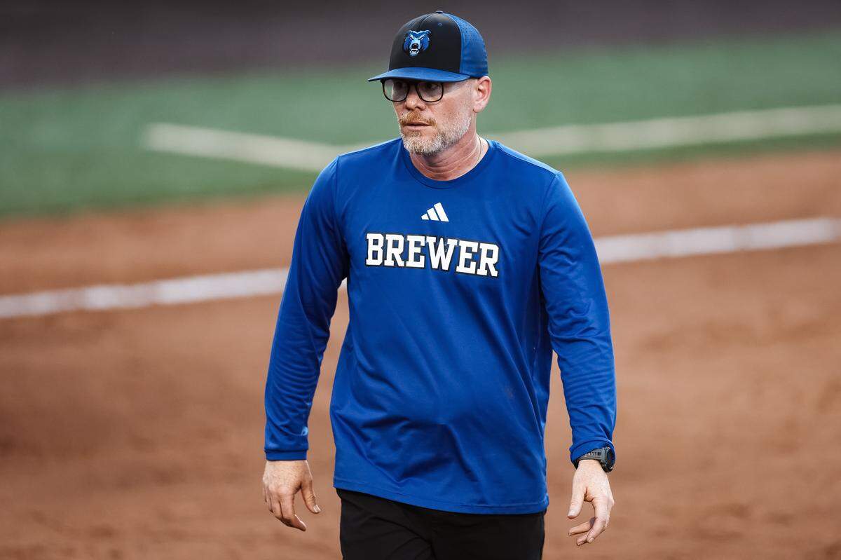 White Settlement Brewer head coach Josh Richards walks toward his dugout after taking a mound visit in the UIL Class 5A Division II state softball championship game against Montgomery Lake Creek at Red & Charline McCombs field in Austin, Texas, on Friday, May 29, 2026.