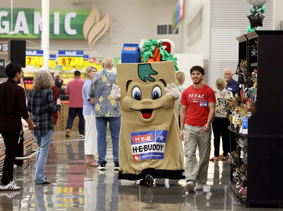 The H-E-B mascot H-E-Buddy greets guests at the ribbon cutting ceremony for the new Mid-Cities H-E-B on Tuesday, May 19, 2026, in Bedford and Euless.