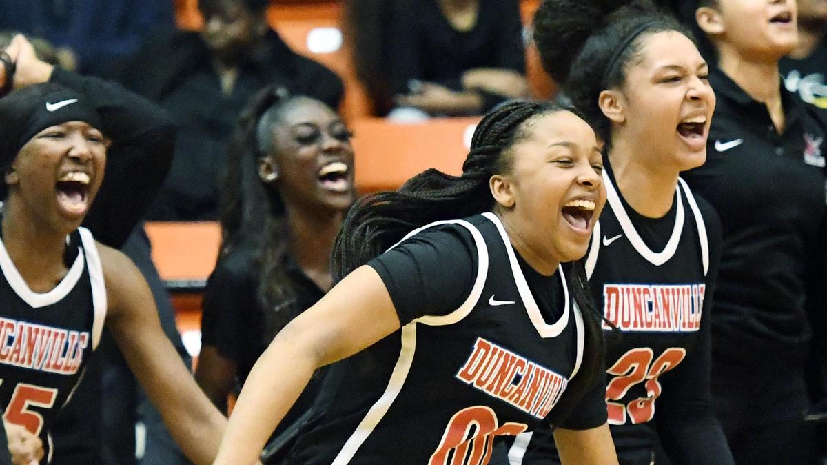 Duncanville’s Hope LeMelle, center and teammates celebrate their 47-43 win over Desoto in the Regional Quarterfinal Playoff basket ball game Tuesday, February 25, 2020 at Wilkerson Greines Activity Center in Fort Worth. Texas. Special/Bob Haynes