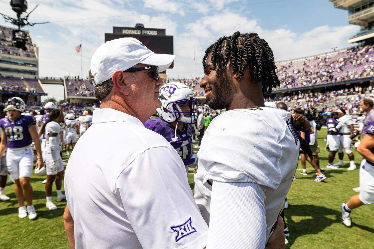 TCU Head Coach Sonny Dykes congratulates Colorado quarterback Shedeur Sanders (2) after the Buffaloes defeated the Horned Frogs 45-42 at Amon G. Carter Stadium in Fort Worth on Saturday, Sept. 2, 2023.