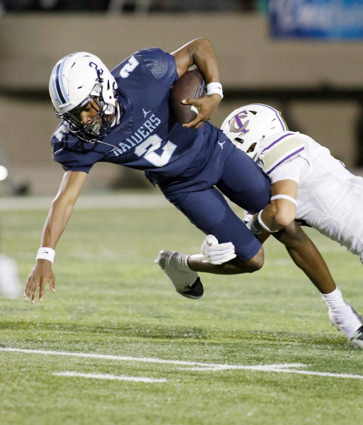 L.D. Bell’s Cameron Johnson is brought down by Timber Creek’s Landyn Hicks during their UIL football game Friday night at Pennington Field in Hurst on Friday Sept. 6, 2024.
