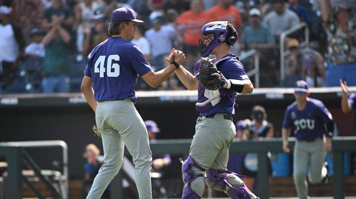 TCU pitcher Ben Abeldt (46) and catcher Karson Bowen (14) celebrate beating Virginia on Saturday in the College World Series.