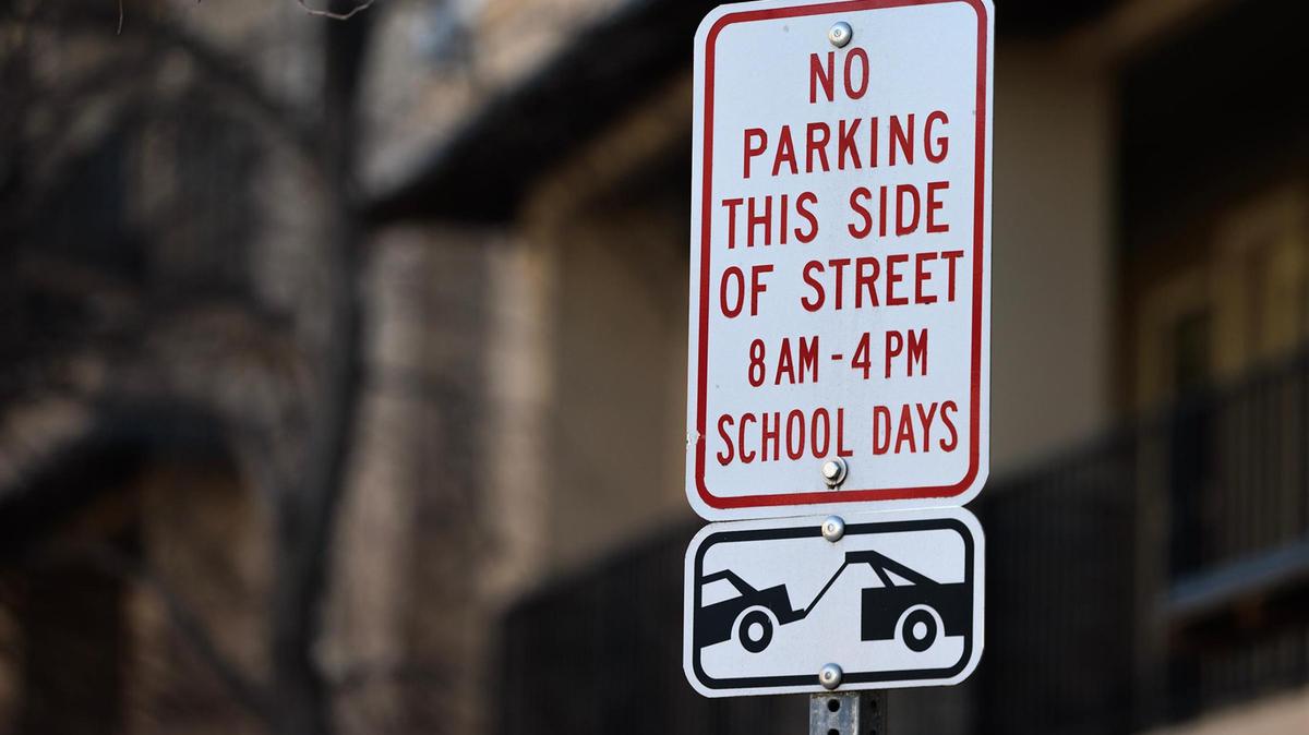 A sign on Sandage Avenue near TCU alerts drivers to a no-parking zone on the west side of the street between 8 a.m. and 4 p.m on school days in Fort Worth.