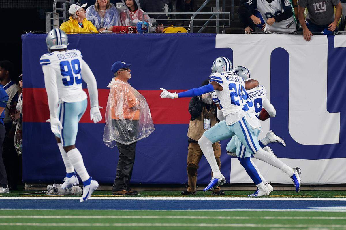 Dallas Cowboys Noah Igbinoghene, right, celebrates with teammates as he returns a blocked punt for a touchdown during the first half of an NFL football game against the New York Giants, Sunday, Sept. 10, 2023, in East Rutherford, N.J.