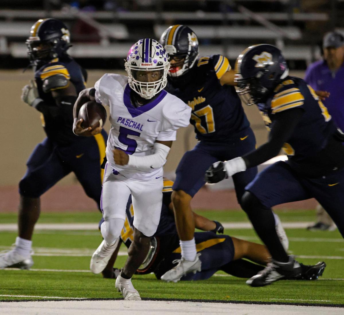 Paschal quarterback Jashaun Thomas (5) takes off on a long run during the Battle of the Bonfire UIL District 4-5A D1 football game at Farrington Field in Fort Worth, Texas, Friday, Nov. 08, 2024.