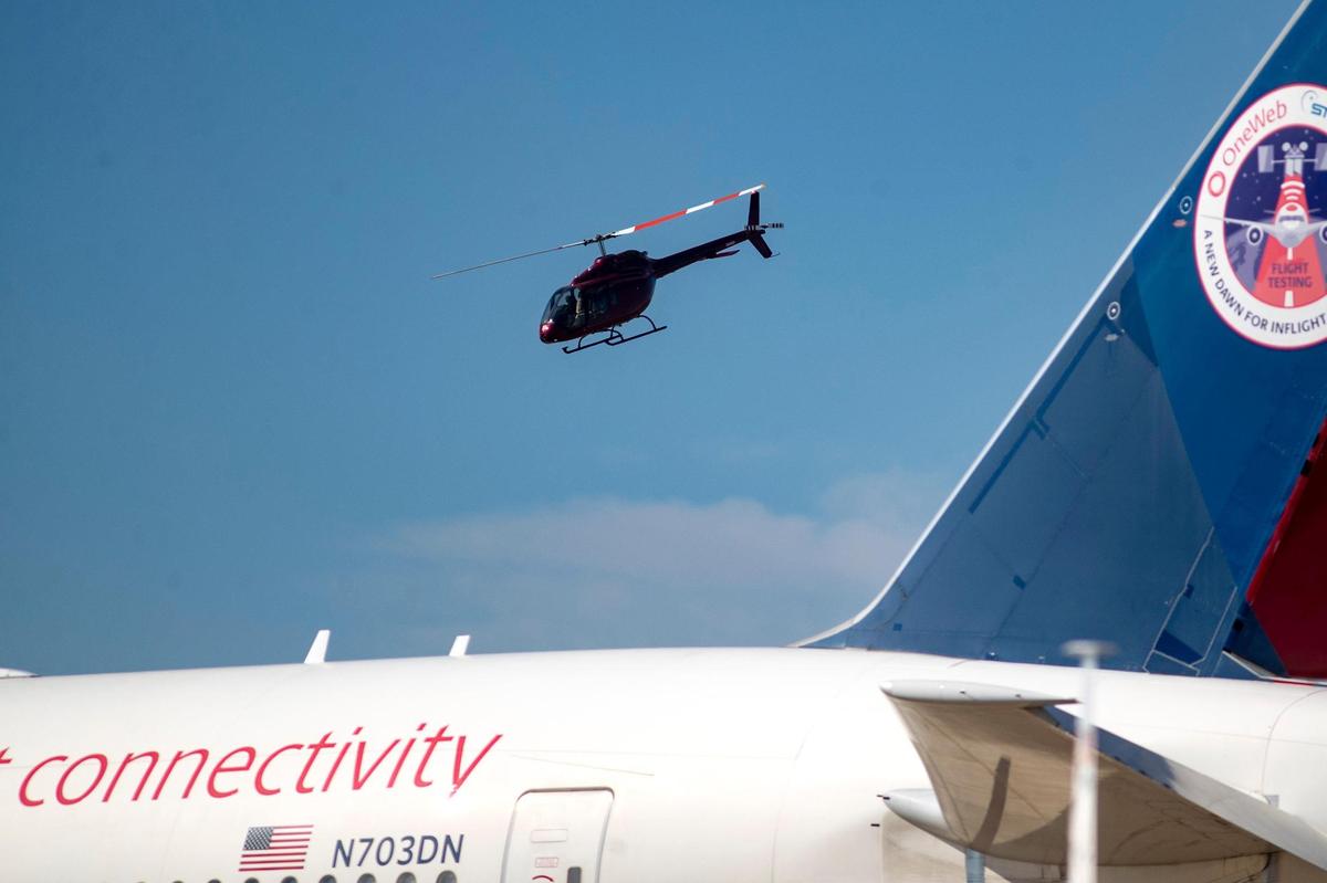 A Bell 505 helicopter flies across the skyline during the AllianceTexas Aviation Expo presented by Bell at the Fort Worth Alliance Airport in Fort Worth on Saturday, Oct. 22, 2022.