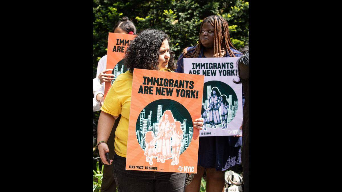 Immigrant advocates attend a new conference near City Hall in May in New York.