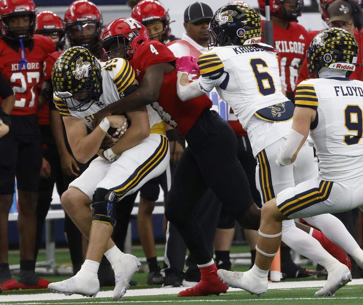 Kilgore wide receiver La'Keyleon Graves (4) stops Stephenville linebacker Hudson Butchee (45) after Butchee intercepted a pass intended for Graves during the first half of the UIL Class 4A Division I championship game on Friday Dec. 19, 2025 at AT&T Stadium in Arlington, Texas.