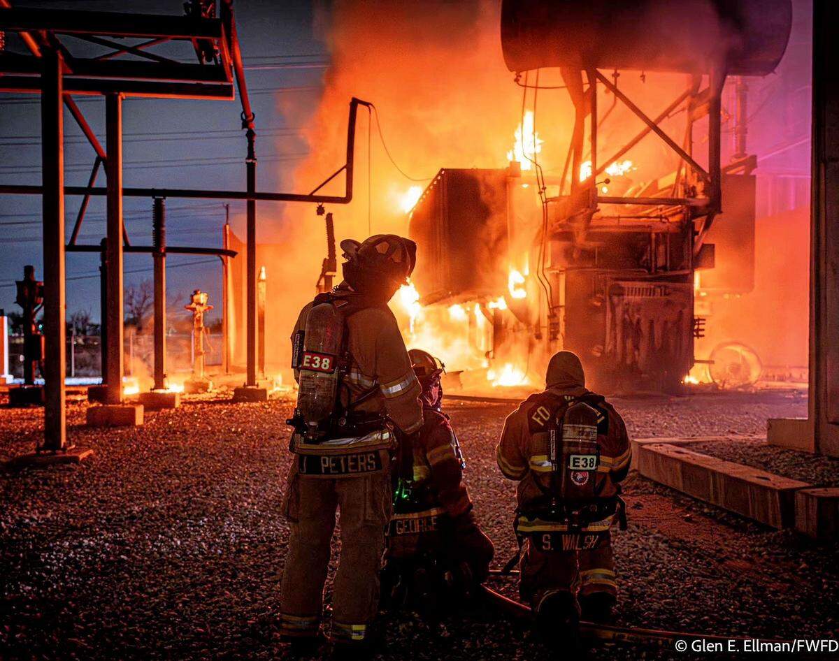 Firefighters battle a blaze at a far north Fort Worth power substation on Wednesday night Jan. 8, 2025.