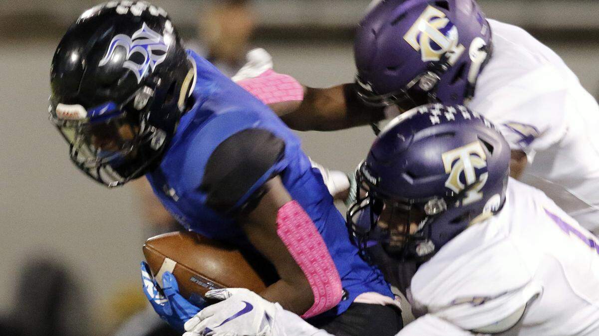 Byron Nelson’s Zachary Johns get yardage in front of Timber Creek’s defense during the first half of a high school football game at Northwest ISD Stadium in Justin, Texas, Thursday, Oct. 17, 2019.