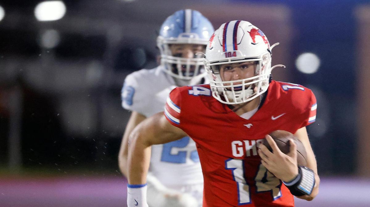Grapevine quarterback Harrison Hackbarth (14) picks up a first down on second and 25 in the first half of a UIL 5A D2 football playoff game at Mustang Panther Stadium in Grapevine, Texas, Thursday, Nov. 09, 2023.