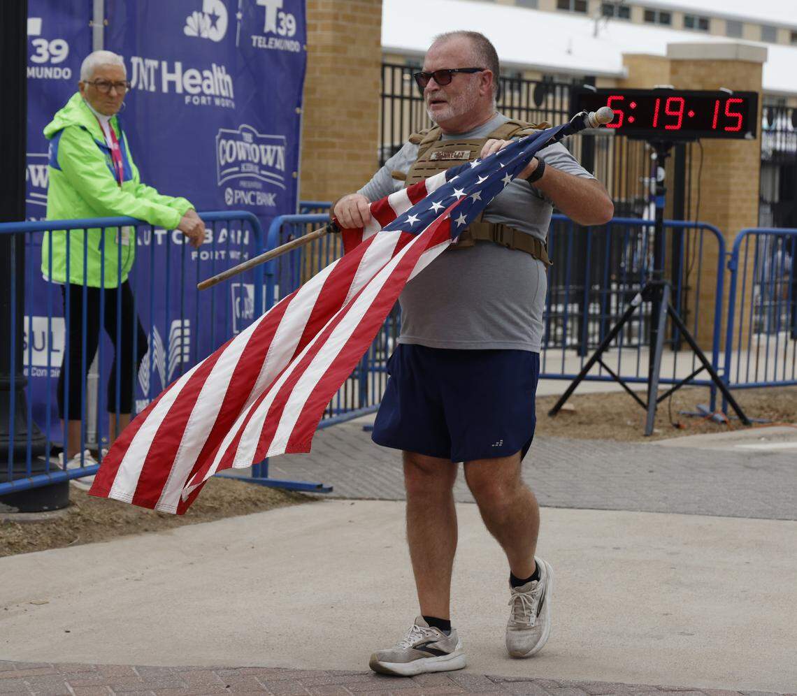 Mike Donnelly crosses the finish line after competing in the 48th running of the Cowtown Marathon at the Will Rogers Memorial Center in Fort Worth, Texas, Sunday, Mar. 01, 2026.