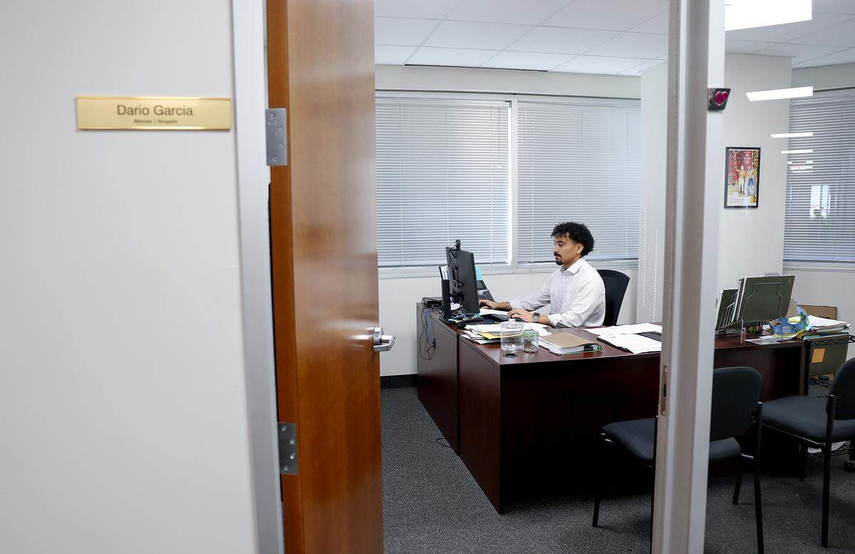 Immigration attorney Dario Garcia works at the Dallas office of  Jaime Barron PC on Wednesday, Jan. 14.