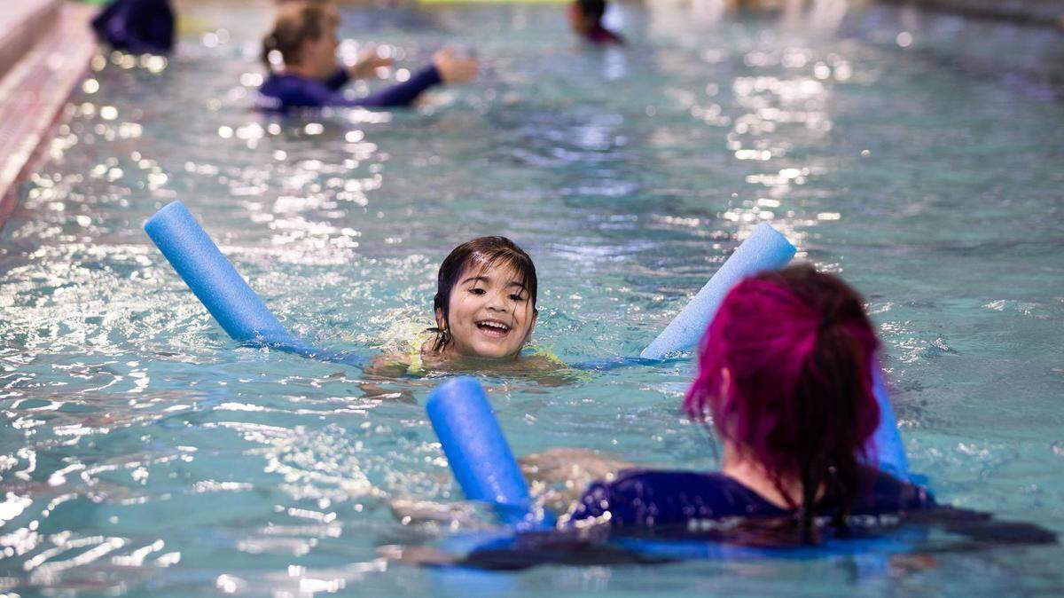 Emma Martinez, 4, swims toward instructor Abigail Hackney during a swim lesson in March at the Benbrook YMCA. Fort Worth is behind on is plans to build public pools.