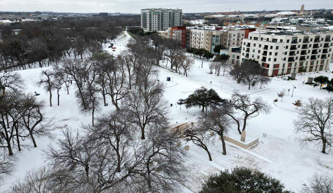 Snow covers the ground at Trinity Park off West 7th Street in Fort Worth on Sunday, Jan. 25, 2026.